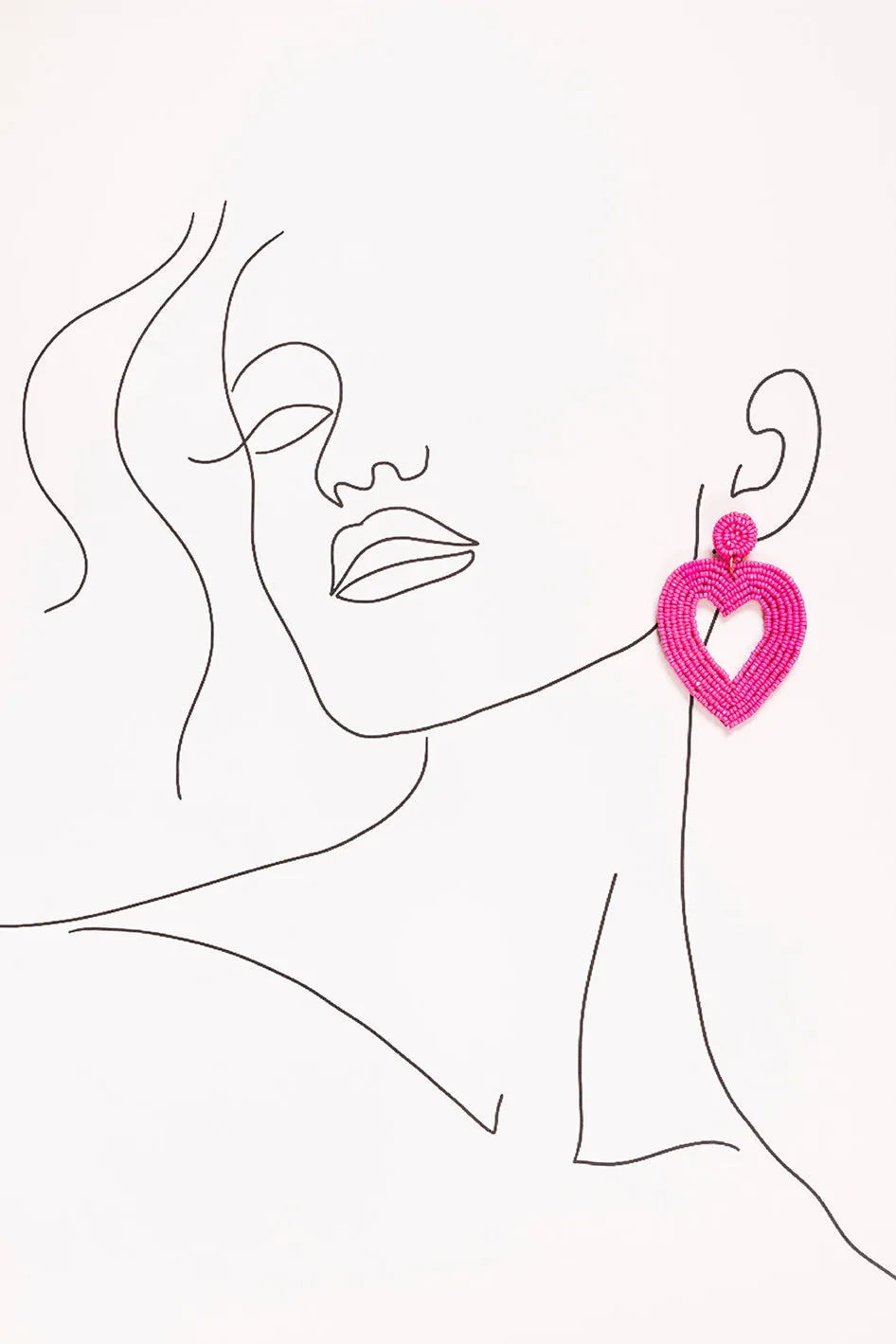 Hollow Heart Beaded Earrings in Hot Pink sold by Adrift