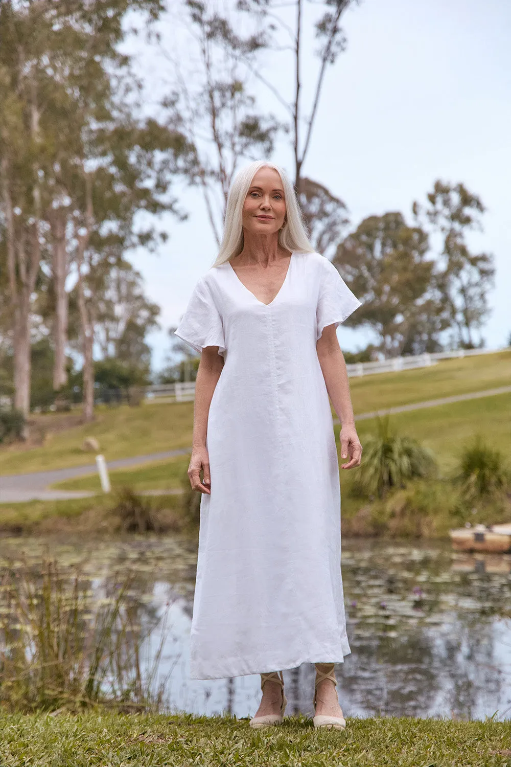 Tatum Linen Flutter Sleeve Dress in White sold by Adrift