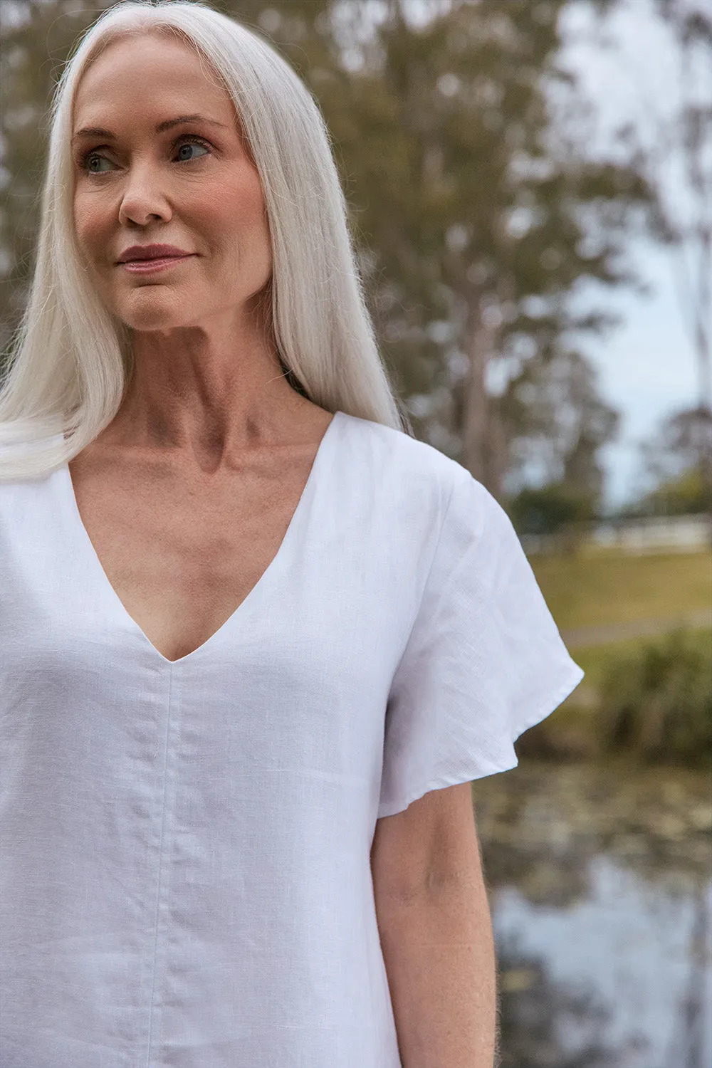 Tatum Linen Flutter Sleeve Dress in White sold by Adrift product image thumbnail 3