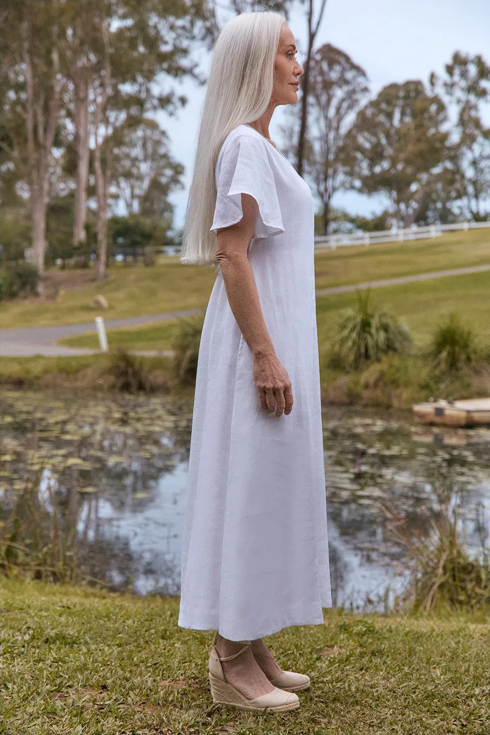 Tatum Linen Flutter Sleeve Dress in White sold by Adrift product image thumbnail 4