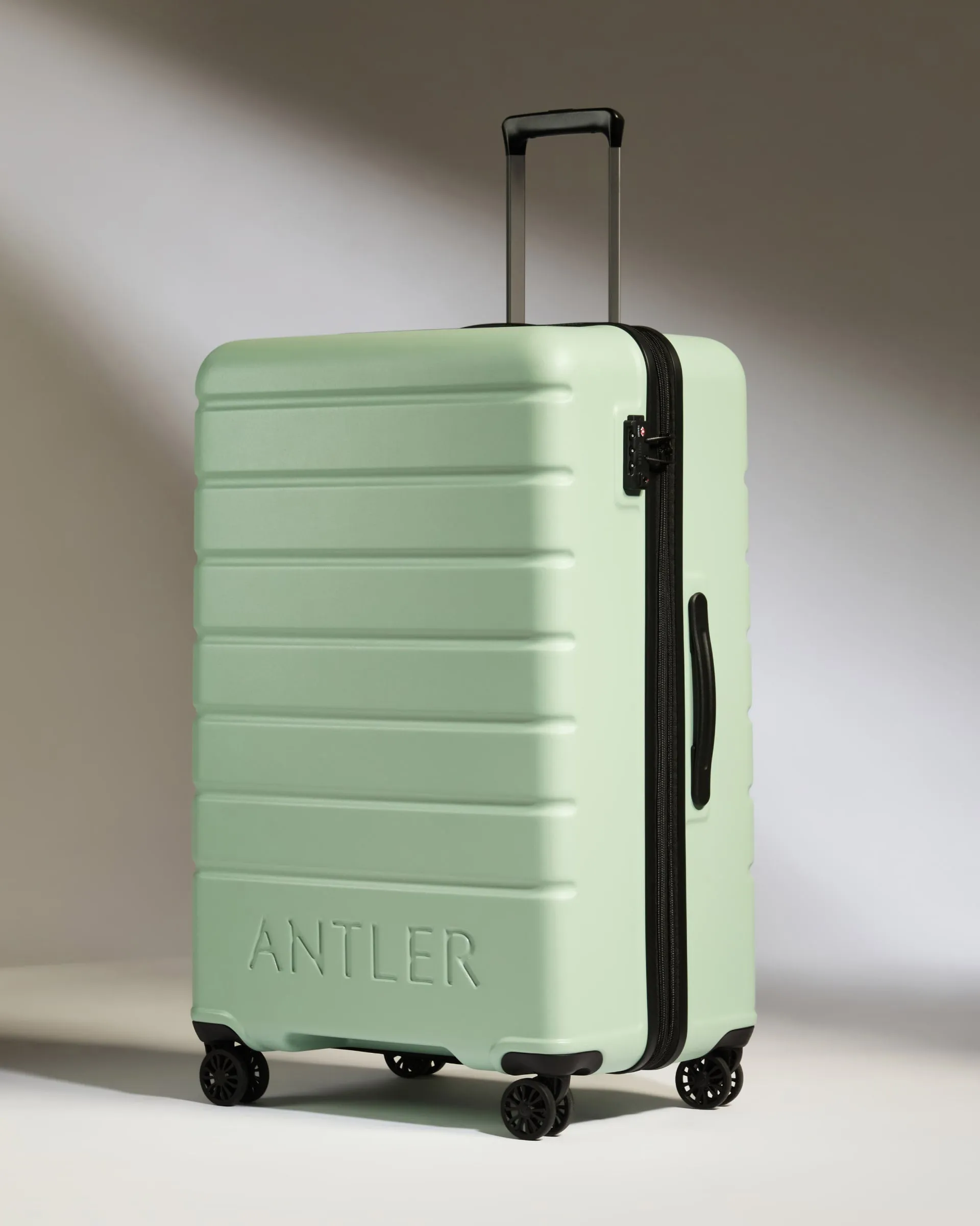 Large Luggage in Aspen Green - Logo sold by Antler