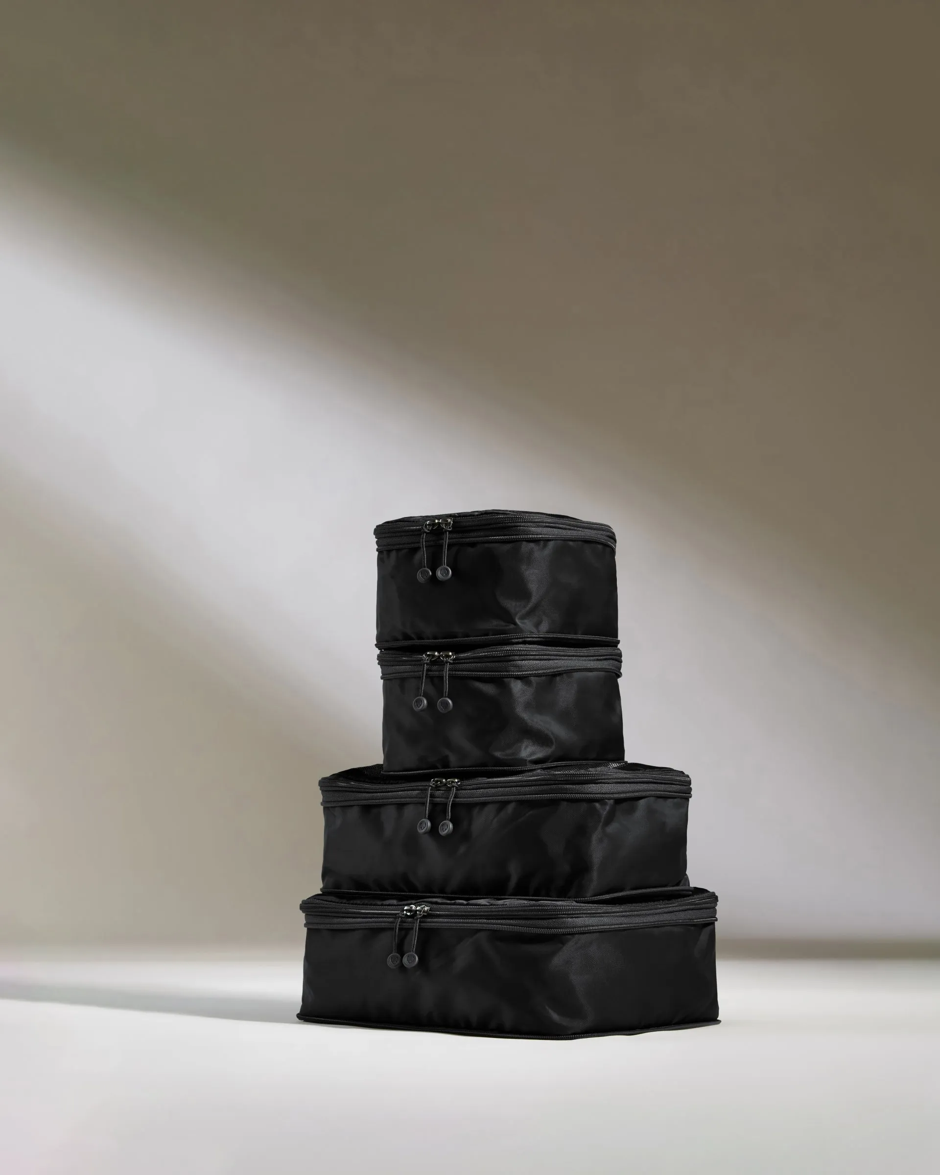 Packing Cubes in Black - Set of 4 sold by Antler