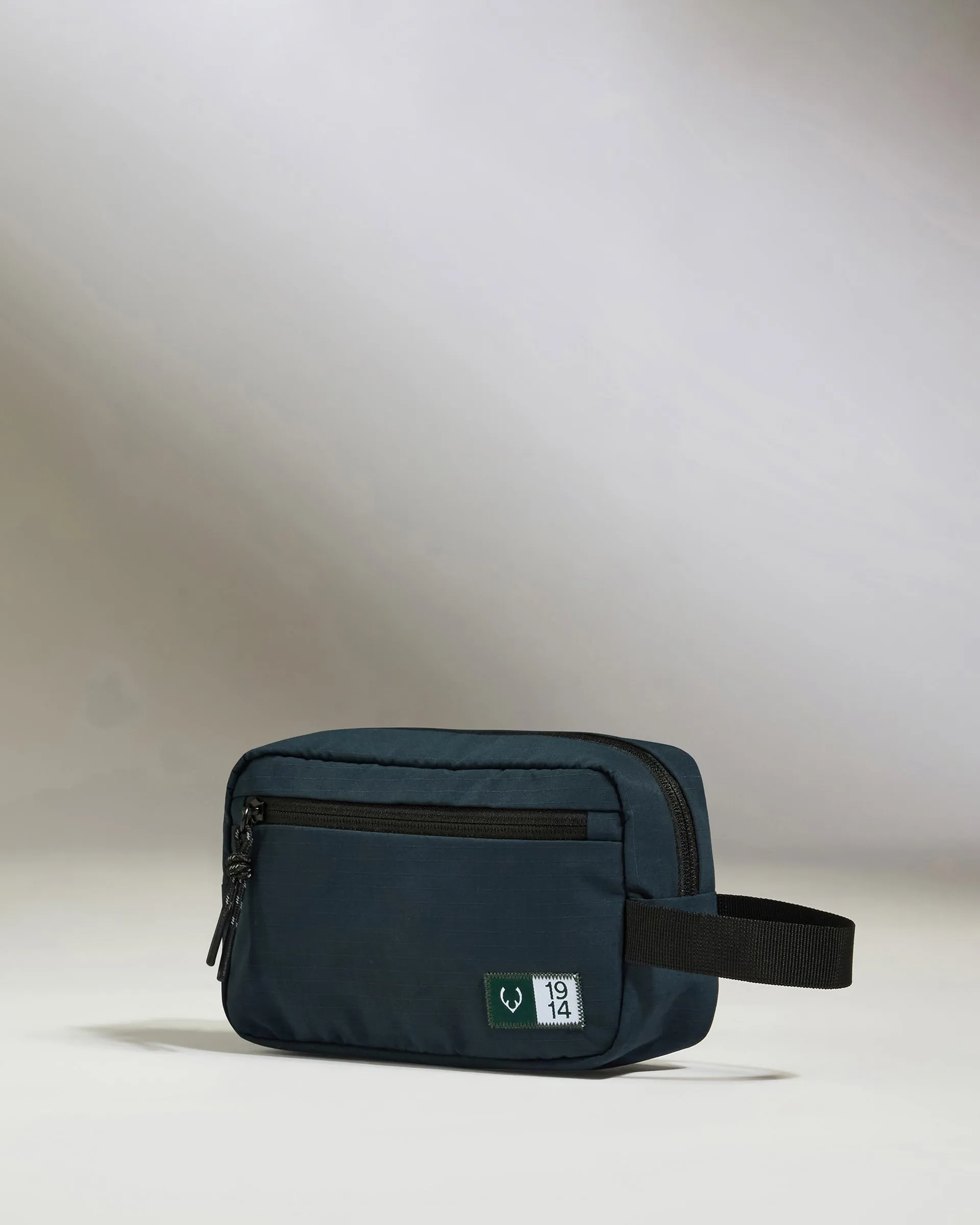 Essential Toiletry Bag in Navy sold by Antler