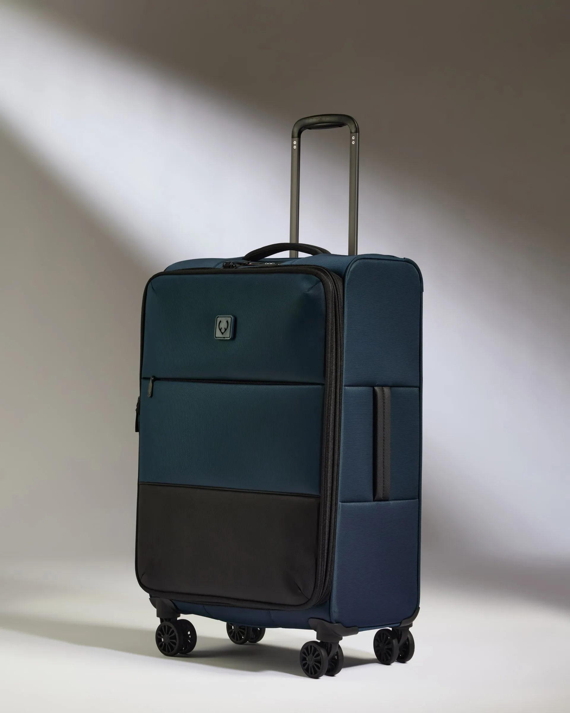 Lightest Medium Luggage in Indigo Blue - Soft Stripe 2.0 sold by Antler