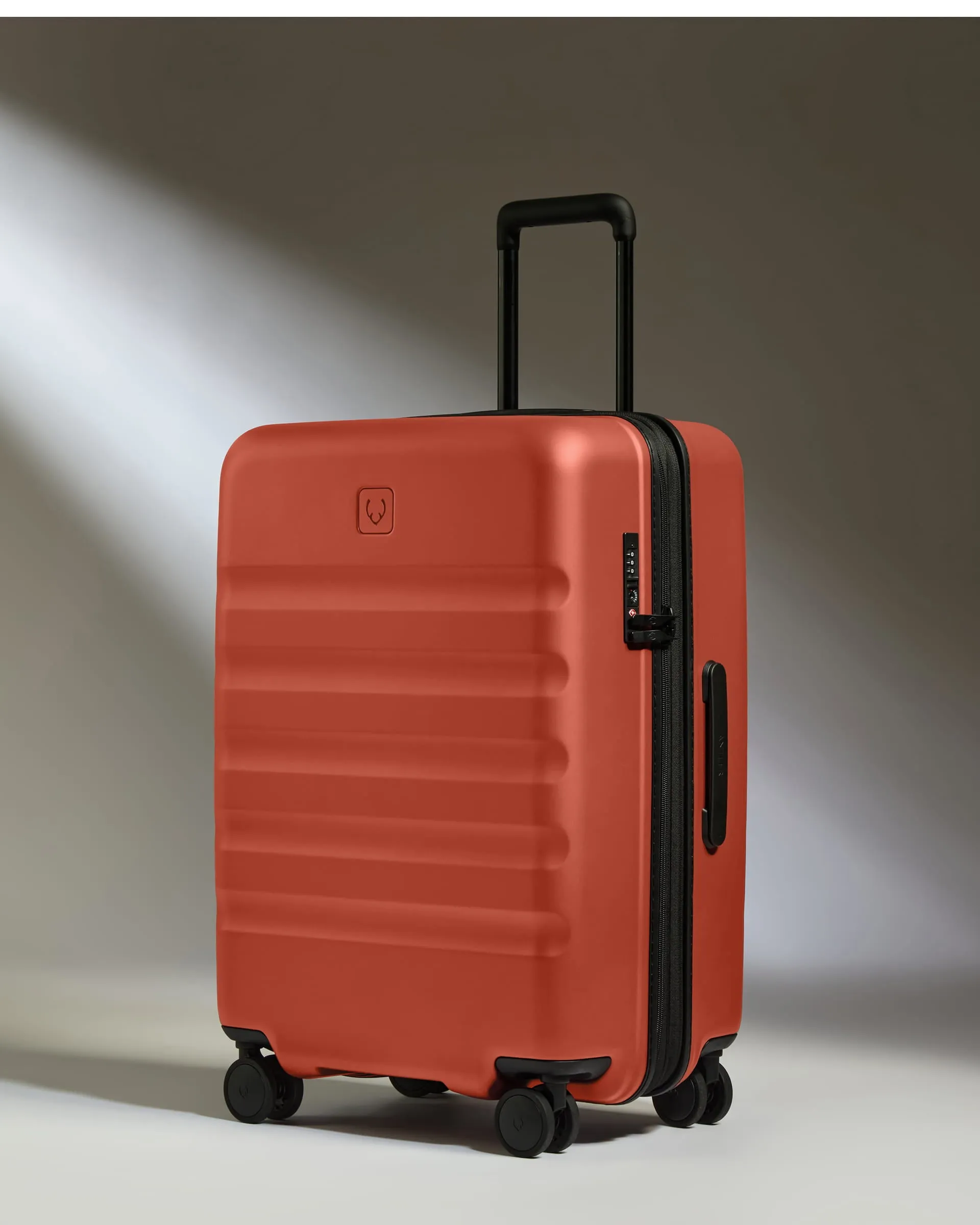 Medium Luggage in Buckthorn Red - Icon Stripe sold by Antler