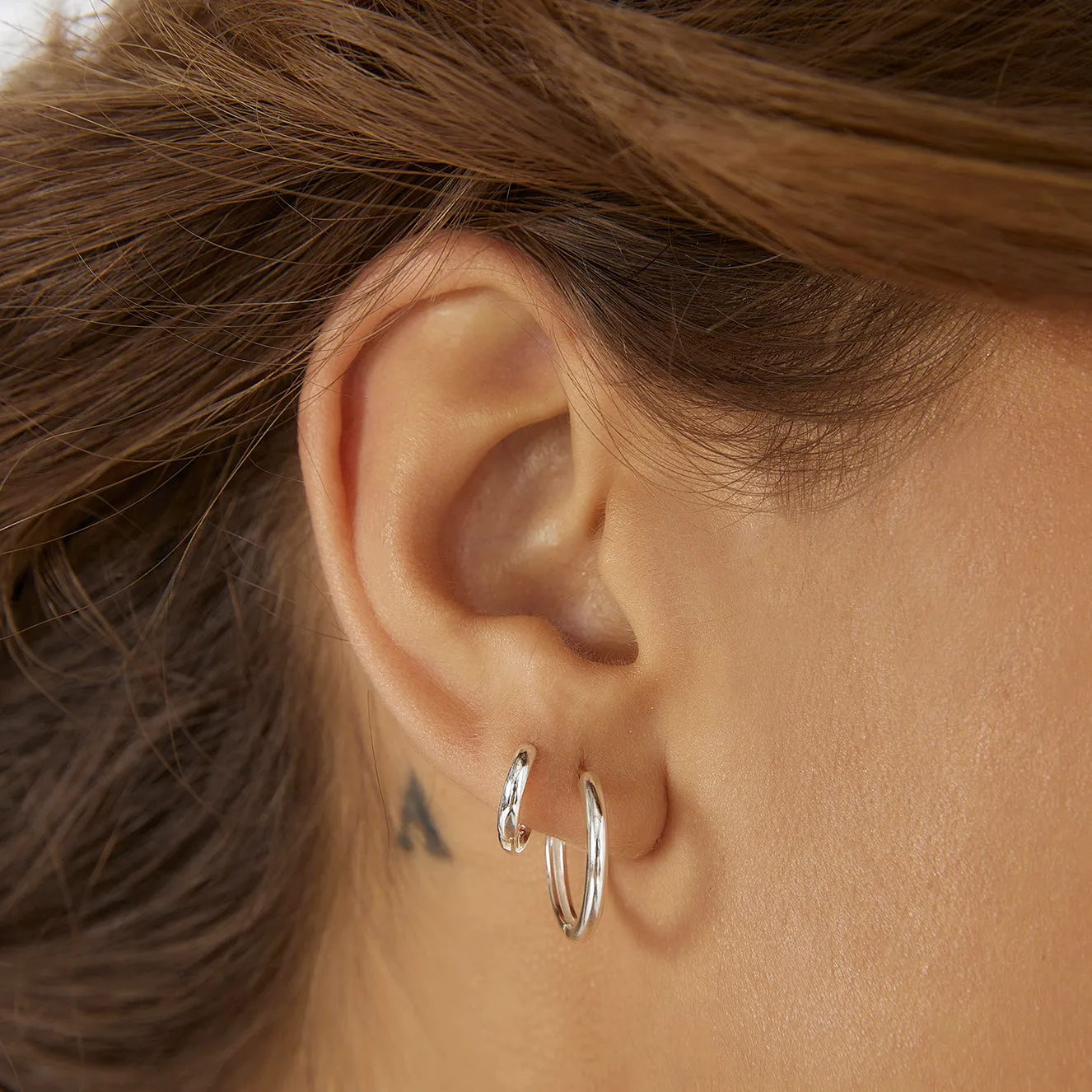 Shia Silver Huggie Earrings sold by Arms Of Eve product image thumbnail 2