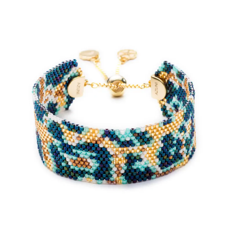 Narrow Snow Leopard Bead Cuff: Tulum sold by Azuni London