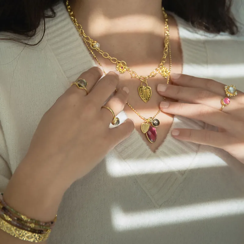 Janus Gold Charm Necklace sold by Azuni London