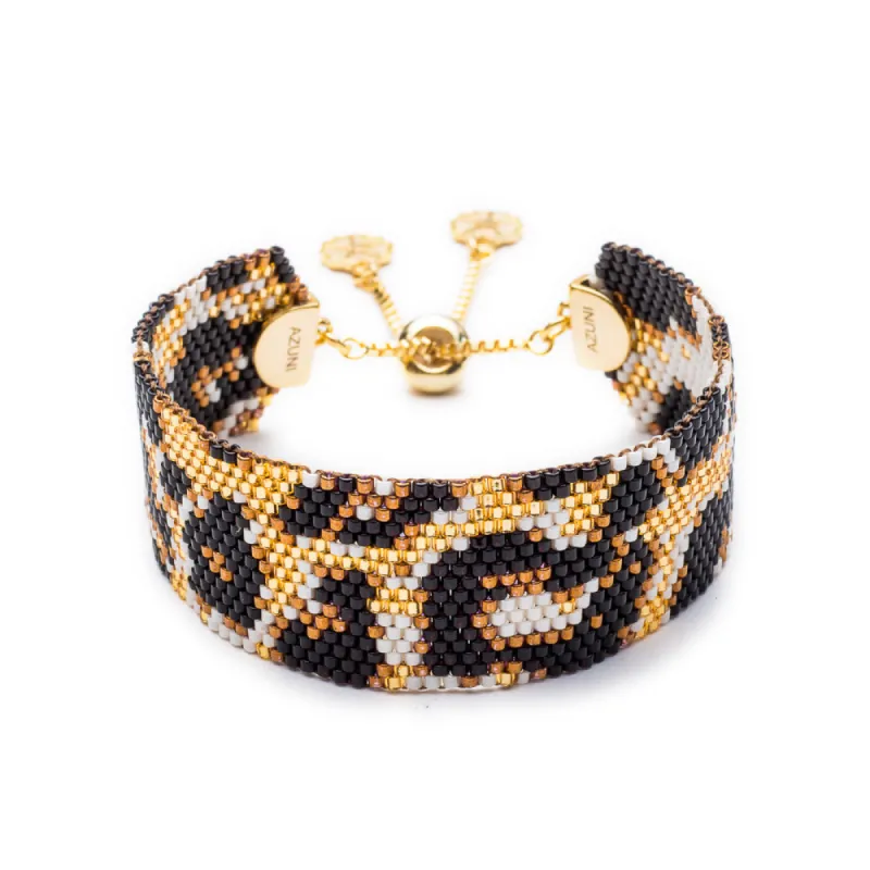 Narrow Snow Leopard Bead Cuff: Lynx sold by Azuni London
