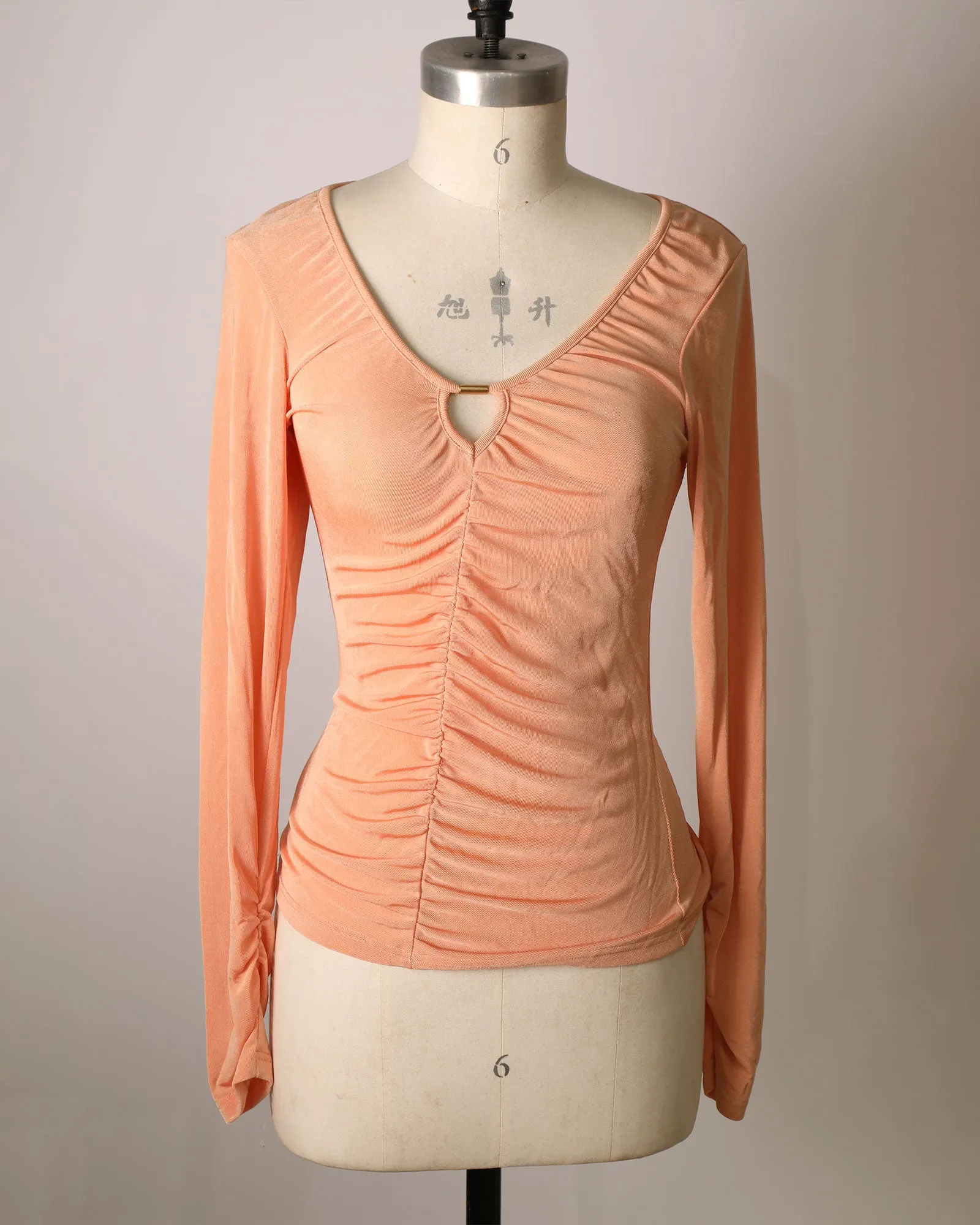 Long Sleeve Ruched Front Top with Cut-Out Detailing - Peach sold by Belle & Bloom
