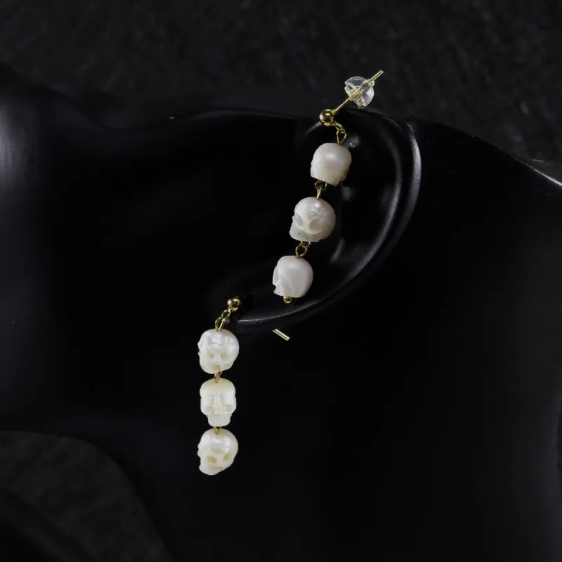 Three Pearl Skull Dangle Earrings sold by Belle Juri