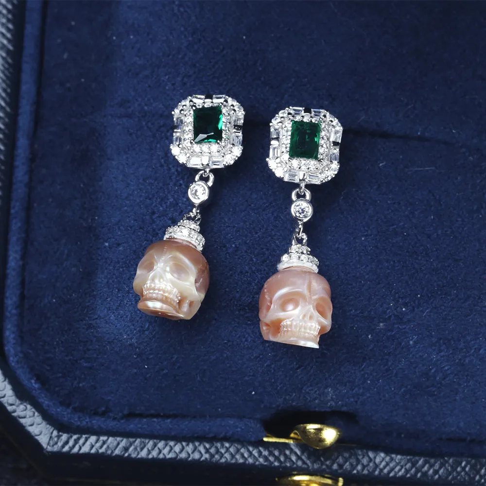 Emerald CZ Halo Pearl Skull Dangle Earrings sold by Belle Juri