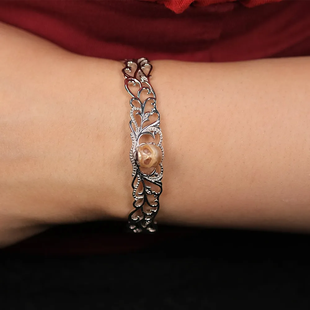Carved Pearl Skull Sterling Silver Bangle Bracelet sold by Belle Juri product image thumbnail 2