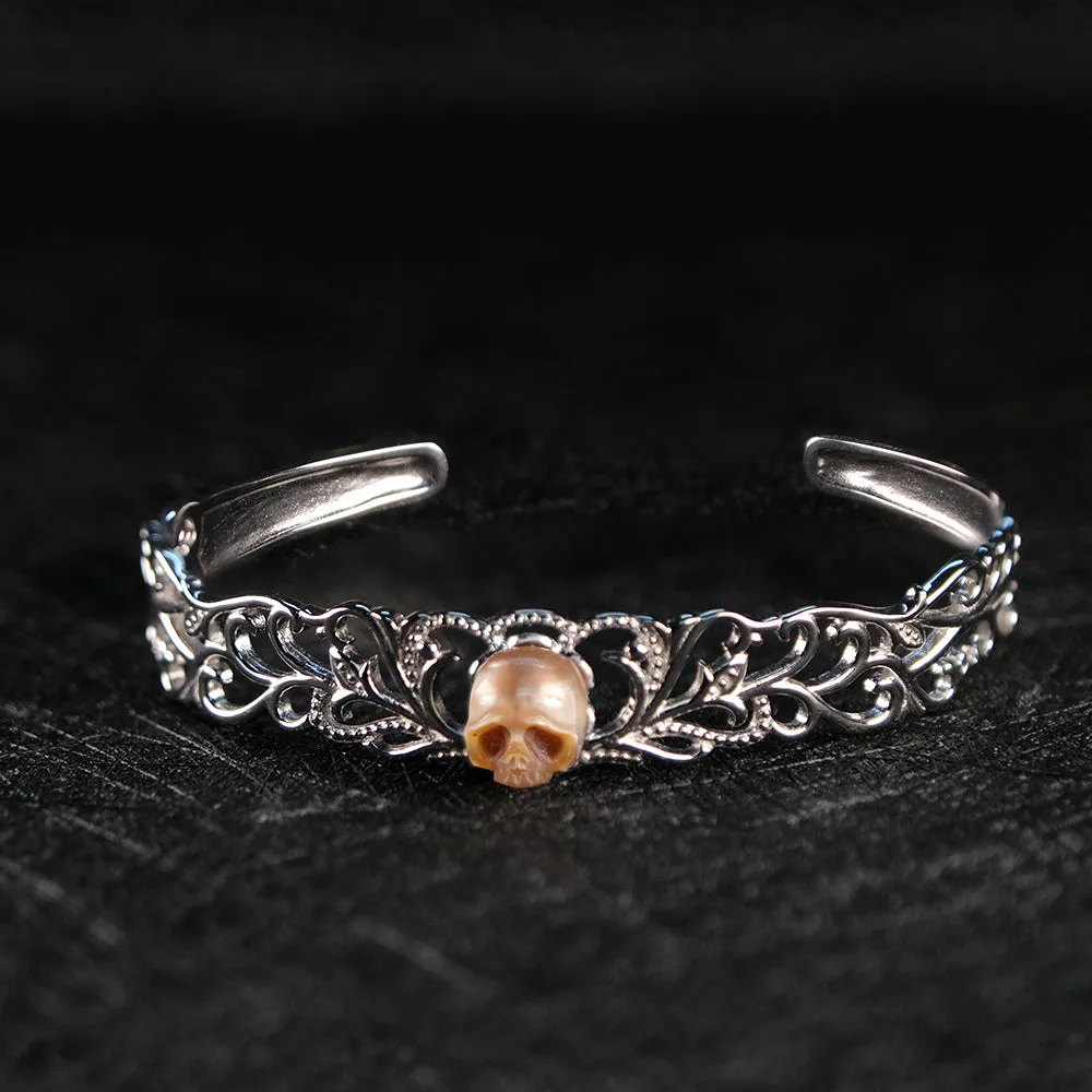 Carved Pearl Skull Sterling Silver Bangle Bracelet sold by Belle Juri