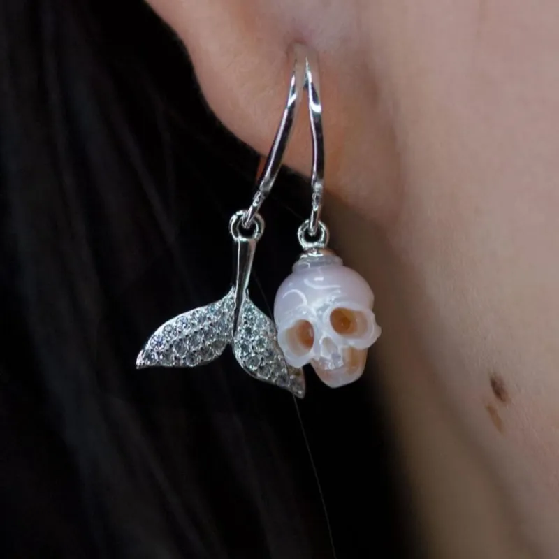 Hand-Carved Pearl Skull Mermaid Earrings with Zircon Tail sold by Belle Juri