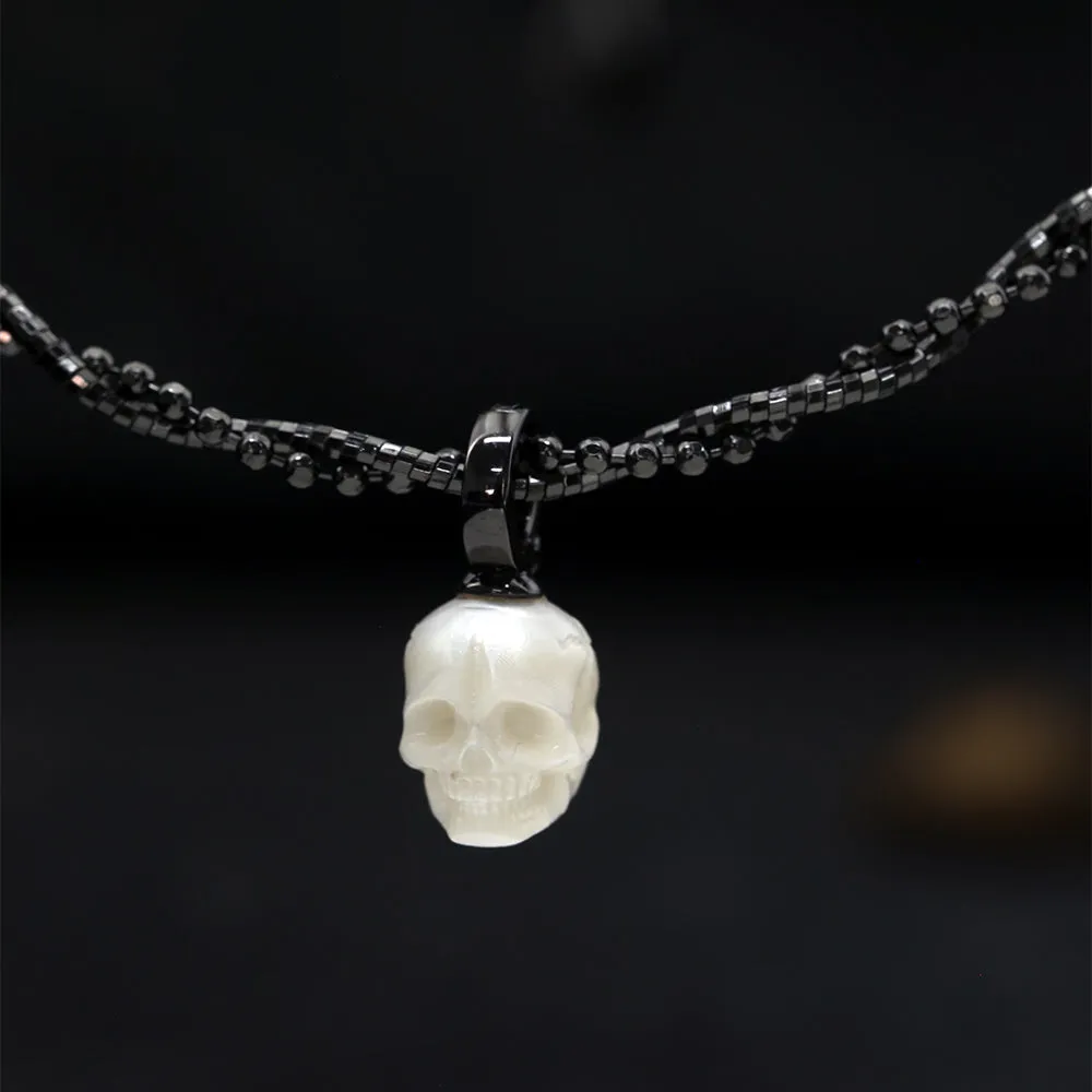 Double-Twist Braided Pearl Skull Necklace sold by Belle Juri