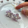 Handwoven Pink Floral Stud Earrings sold by Belle Juri
