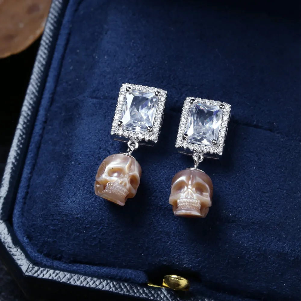 Radiant CZ Halo Pearl Skull Earrings sold by Belle Juri