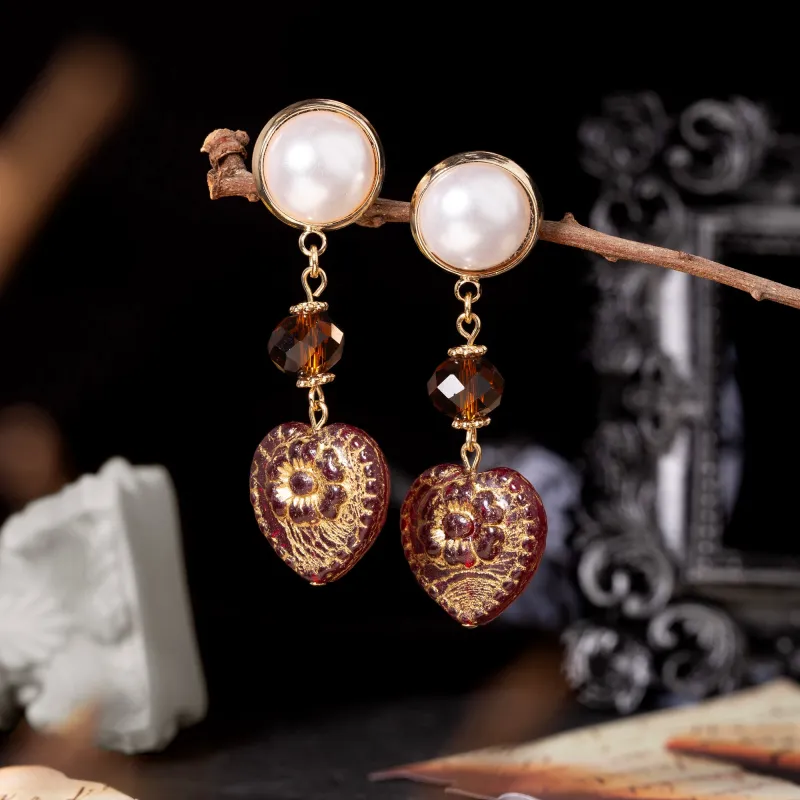 Vintage Palace Carved Pearl Earrings sold by Belle Juri