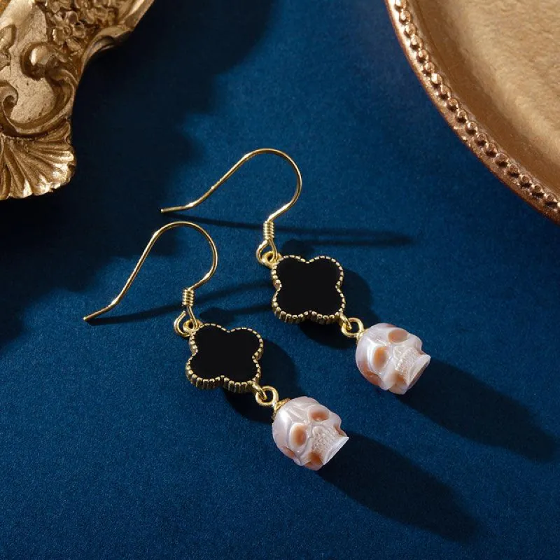 Pearl Skull Four Leaf Clover Dangle Earrings sold by Belle Juri