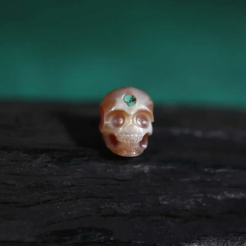Pearl Skull Bead Inlaid With Turquoise Stone sold by Belle Juri