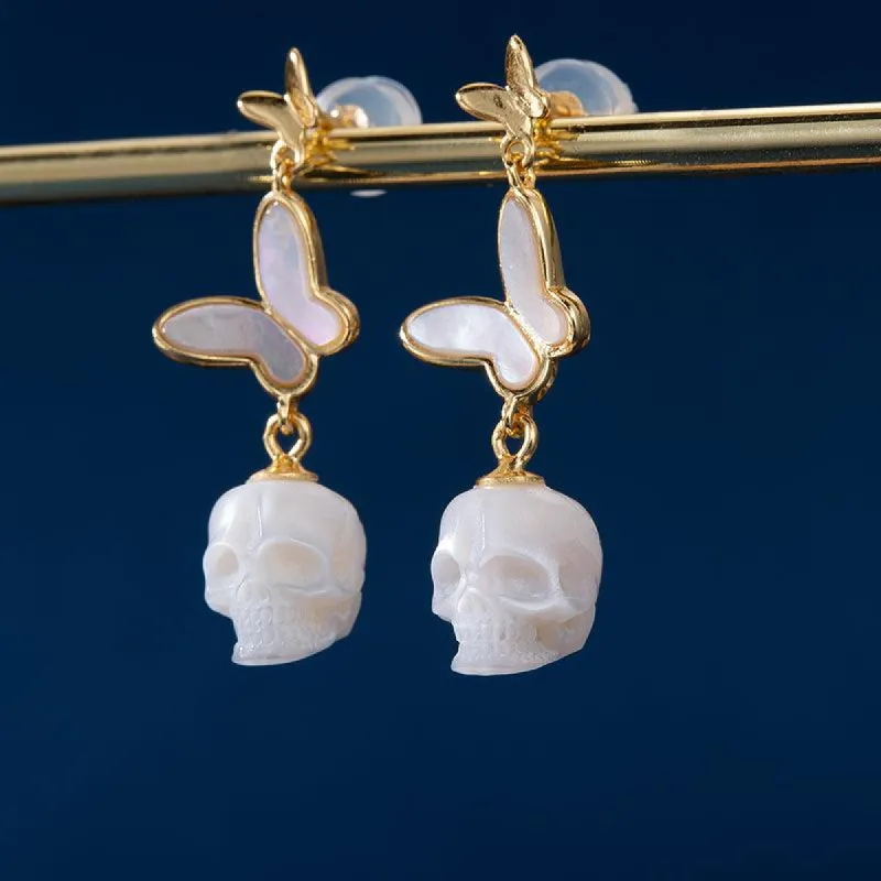 Double Butterfly Pearl Skull Drop Earrings sold by Belle Juri