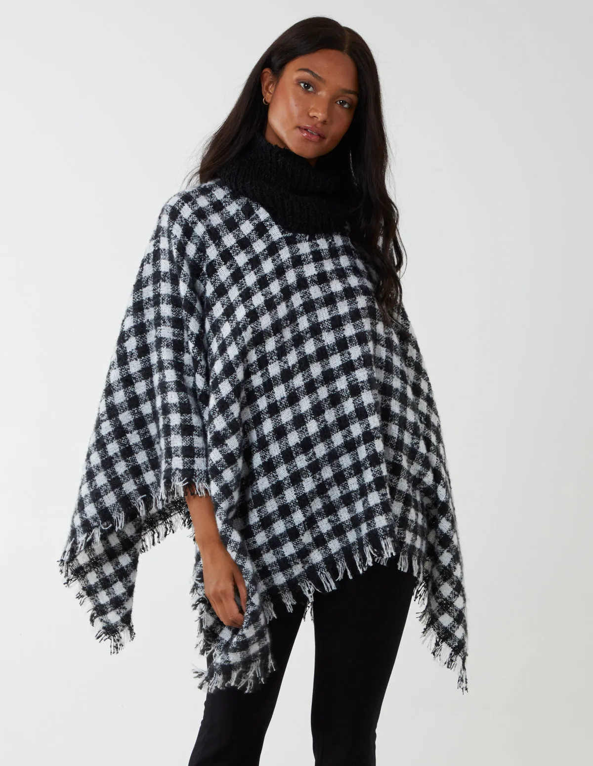 Check Roll Neck Poncho sold by Blue Vanilla