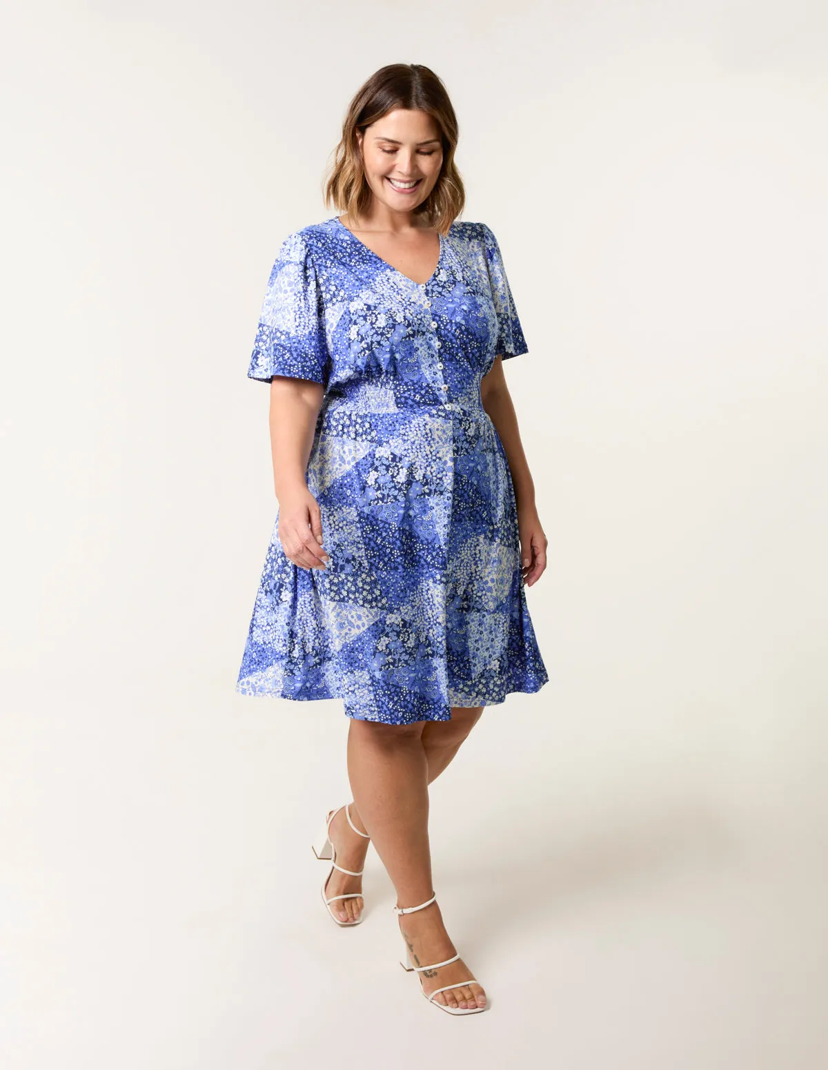 Curve Shirred Waist Button Mini Dress sold by Blue Vanilla