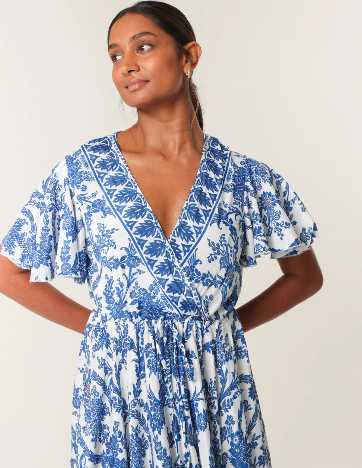 Asymmetric Hem Wrap Dress sold by Blue Vanilla product image thumbnail 2