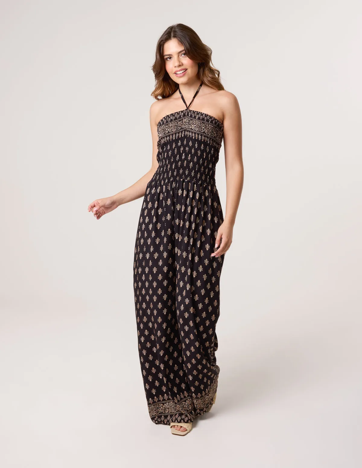 Shirred Wide Leg Border Print Jumpsuit sold by Blue Vanilla
