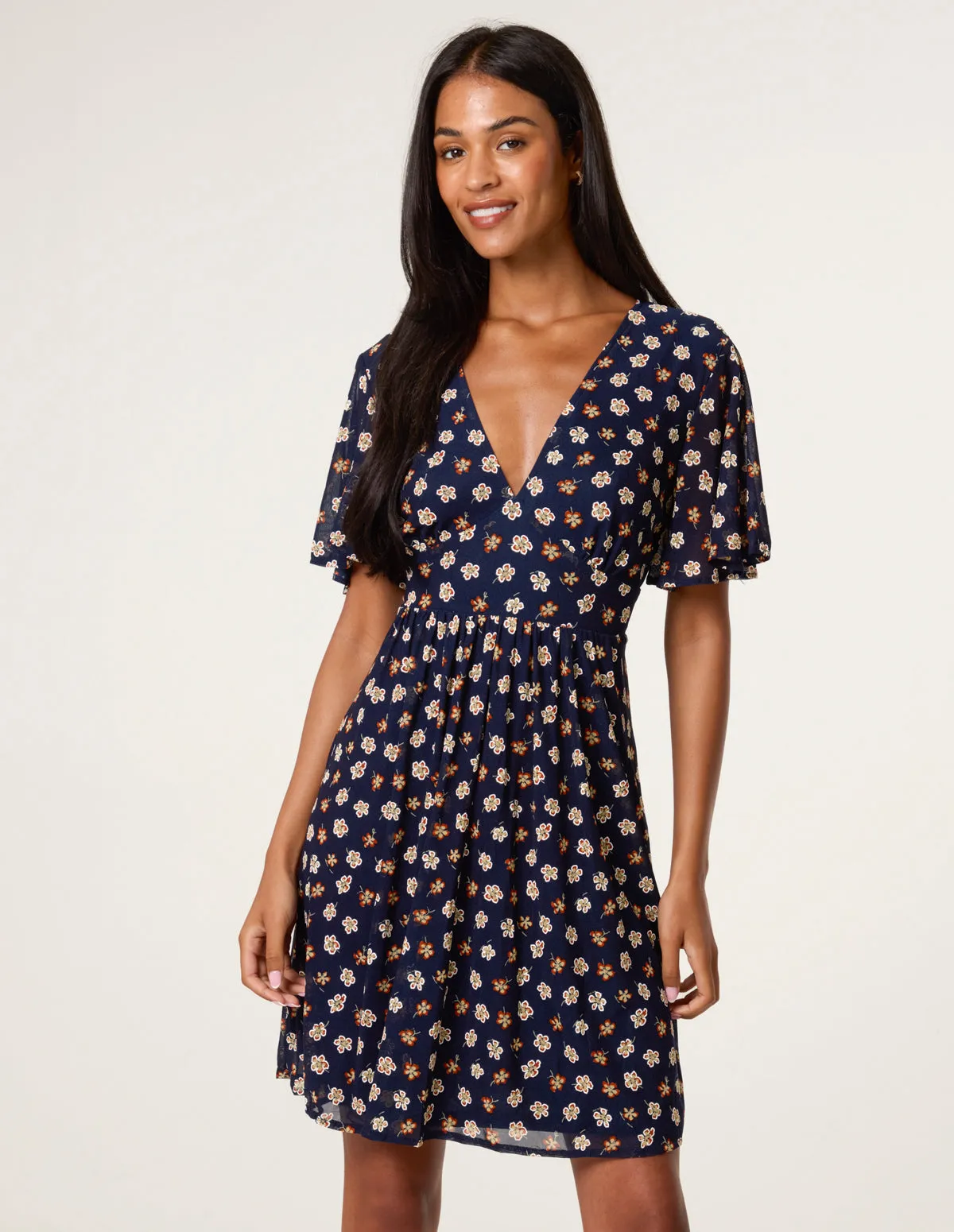 Ditsy Floral V Neck Tie Back Mini Dress sold by Blue Vanilla