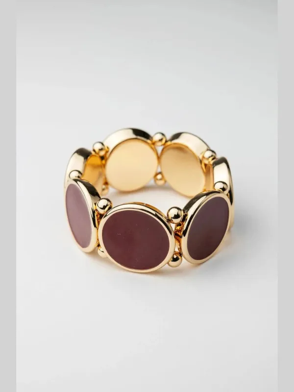 Ava elastic bracelet - gold w deep red sold by Brando