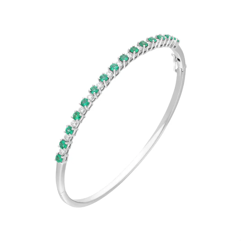 18ct White Gold Emerald Diamond Hinged Bangle sold by C.W. Sellors