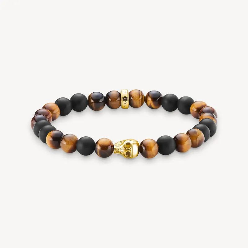 Thomas Sabo Obsidian and Tiger‘s Eye Skull Bracelet sold by C.W. Sellors