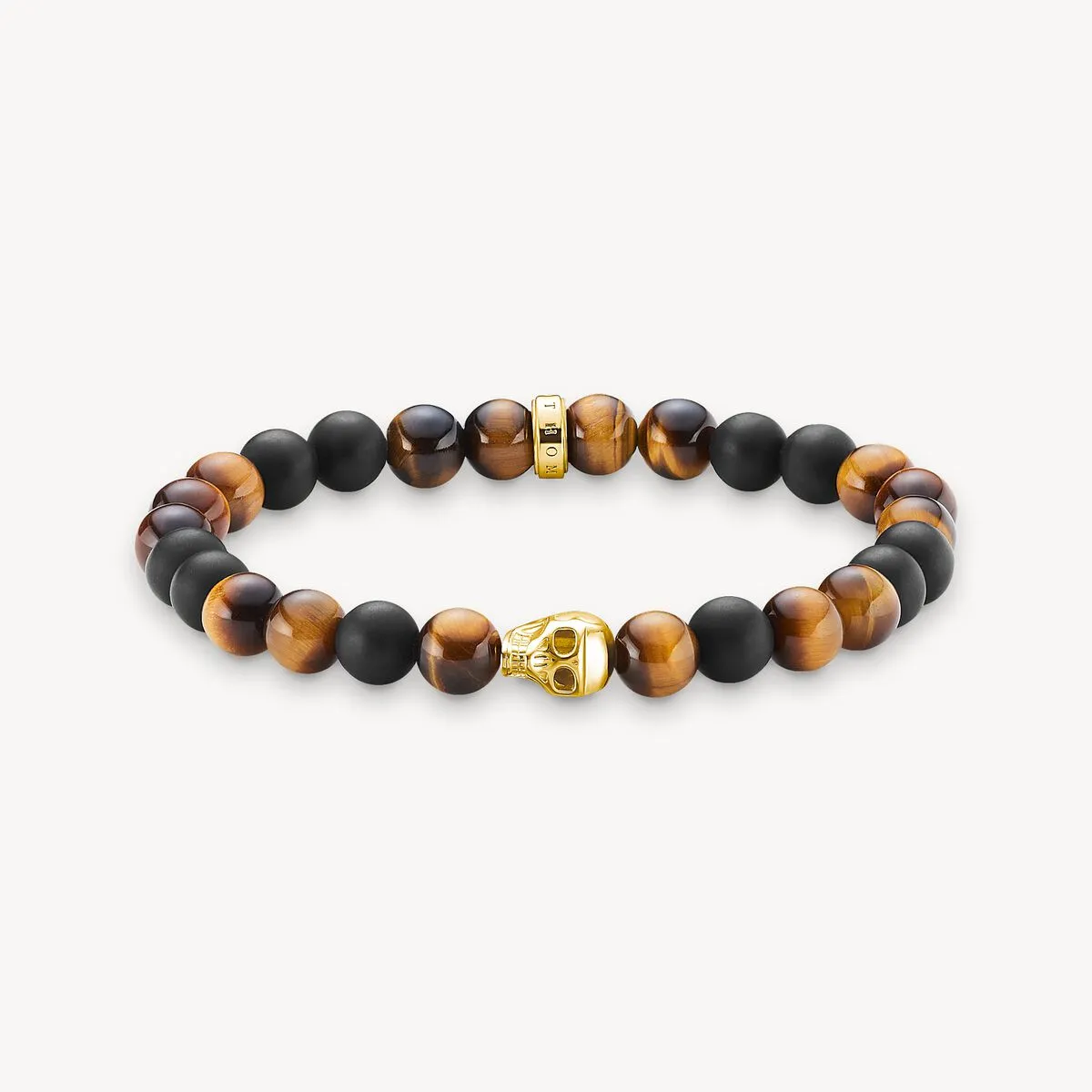 Thomas Sabo Obsidian and Tiger‘s Eye Skull Bracelet sold by C.W. Sellors