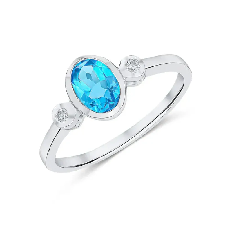 9ct White Gold 7x5 Oval Swiss Blue Topaz & Round Diamond 0.05ct 3st Rubover Ring sold by C.W. Sellors
