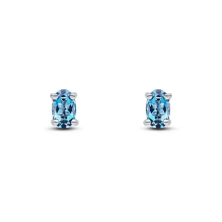 9ct White Gold 5x3 Oval London Blue Topaz Claw Set Earrings sold by C.W. Sellors