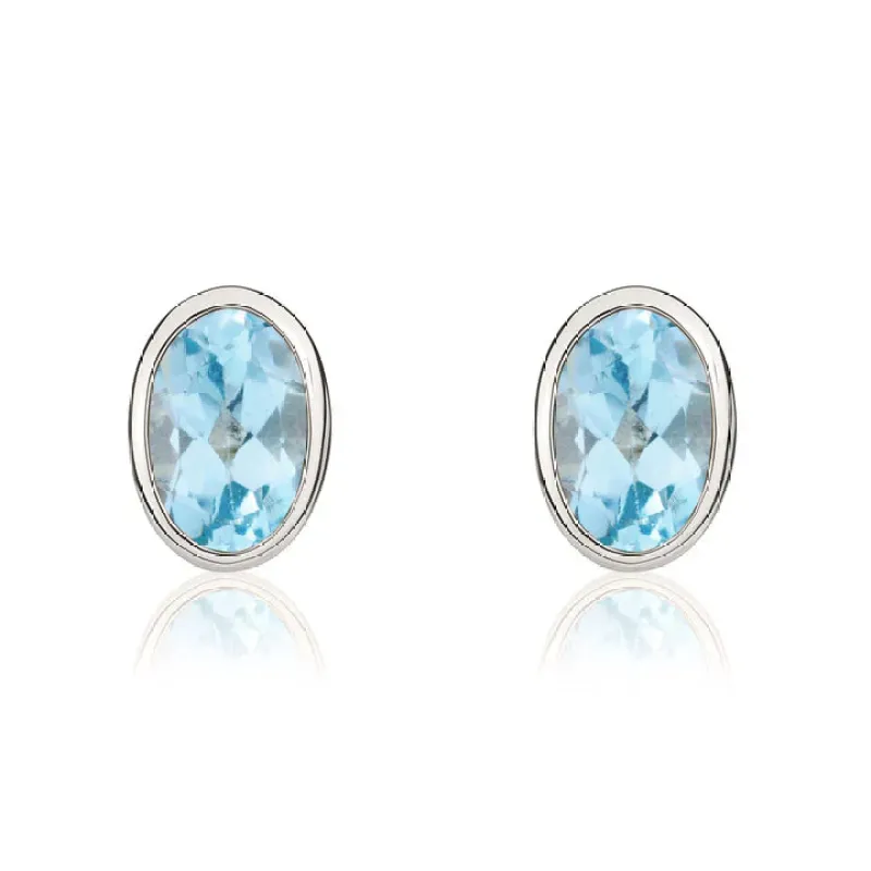 9ct White Gold 6x4 Oval Swiss Blue Topaz Rubover Stud Earrings sold by C.W. Sellors