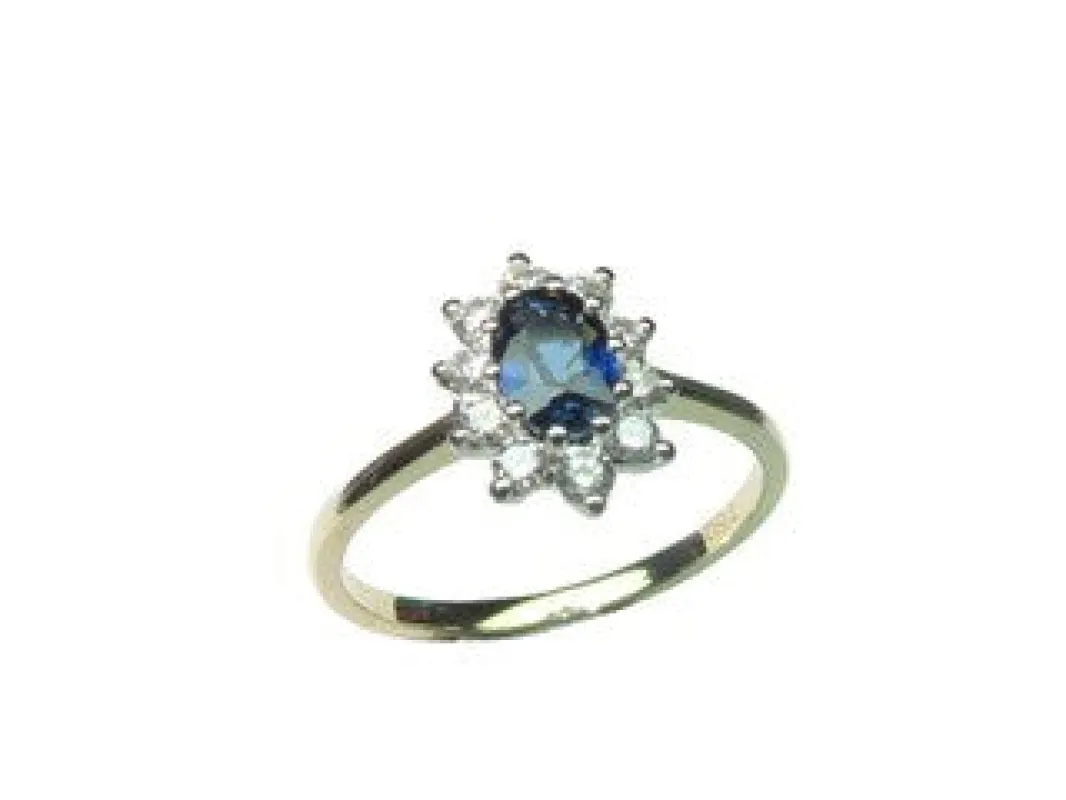 18ct Yellow & White Gold 0.25ct Round Diamond & 0.73ct Oval Sapphire Claw Set Cluster Ring sold by C.W. Sellors