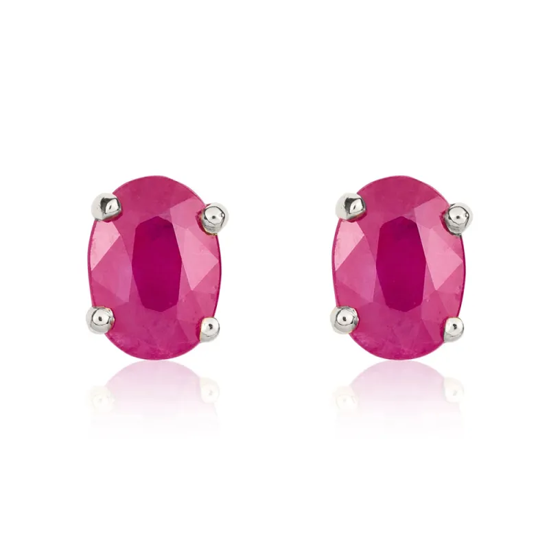 9ct White Gold Ruby 7x5mm Oval Claw Set Stud Earrings made by C.W. Sellors