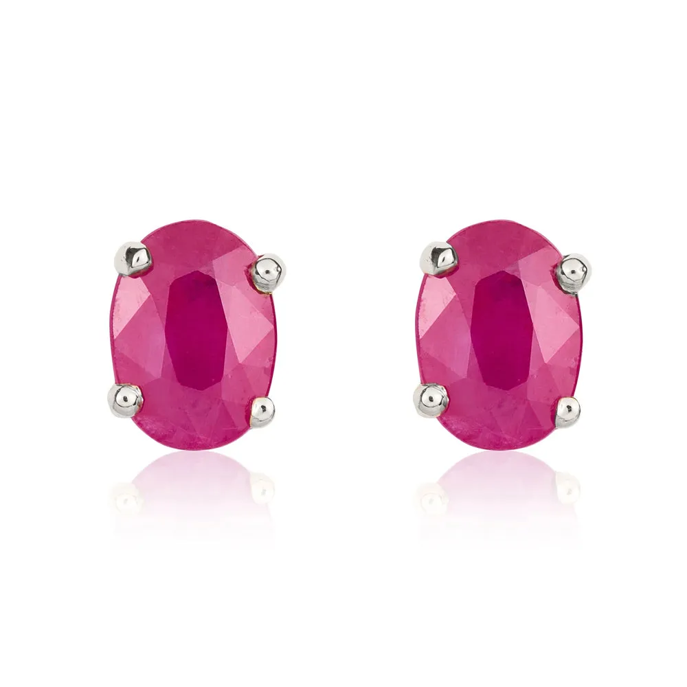 9ct White Gold Ruby 7x5mm Oval Claw Set Stud Earrings sold by C.W. Sellors