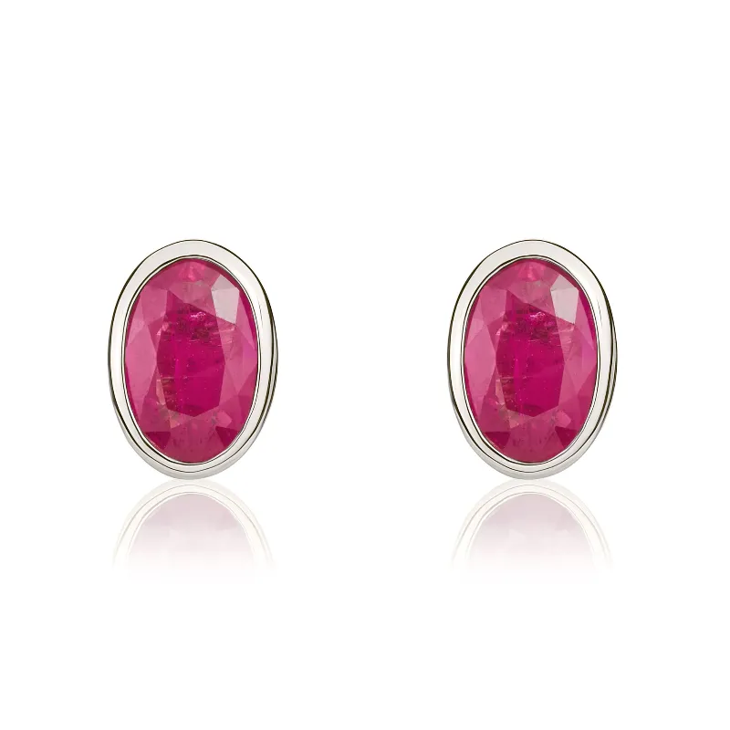 9ct White Gold Ruby 6x4mm Oval Rub Over Set Stud Earrings made by C.W. Sellors