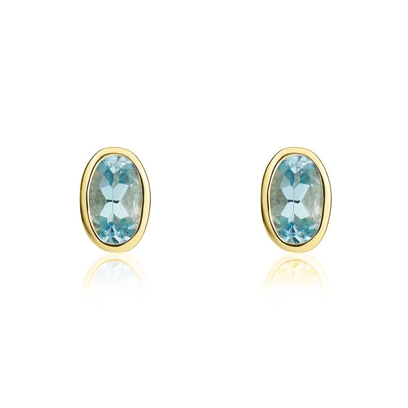 9ct Yellow Gold Aquamarine 5x3mm Oval Rub Over Set Stud Earrings made by C.W. Sellors