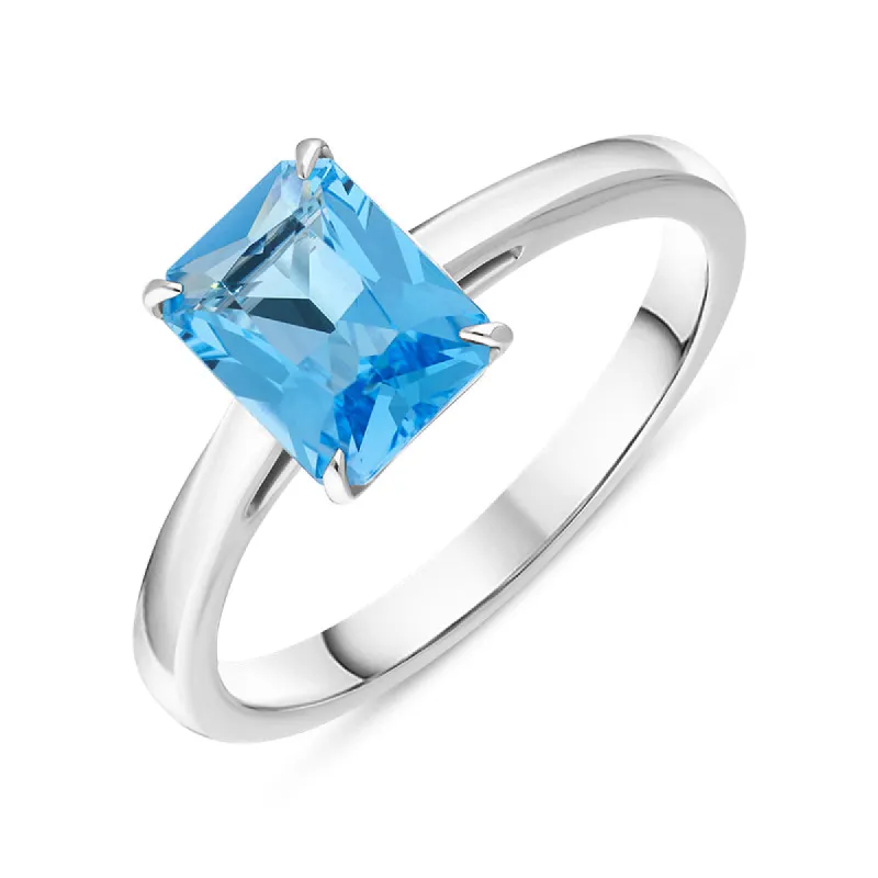 18ct White Gold Blue Topaz Emerald Cut Solitaire Ring D sold by C.W. Sellors