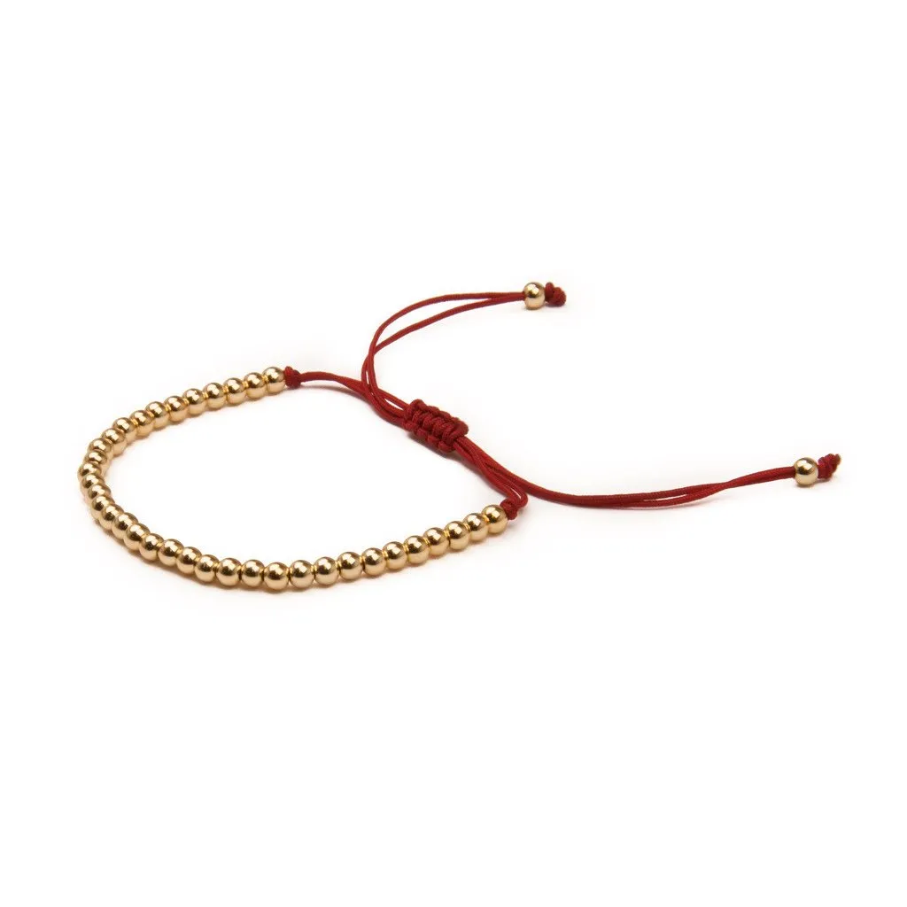 METAL BEAD BRACELET BROAD GOLD RED sold by DARK Department