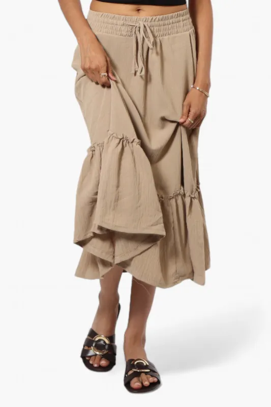 Urbanology Solid Tie Waist Tiered Skirt - Beige sold by Fairweather