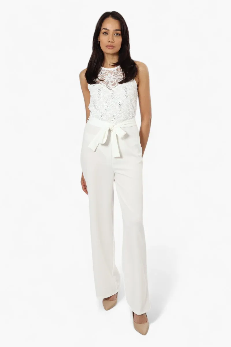 Limite Belted Lace Sequin Jumpsuit - White sold by Fairweather