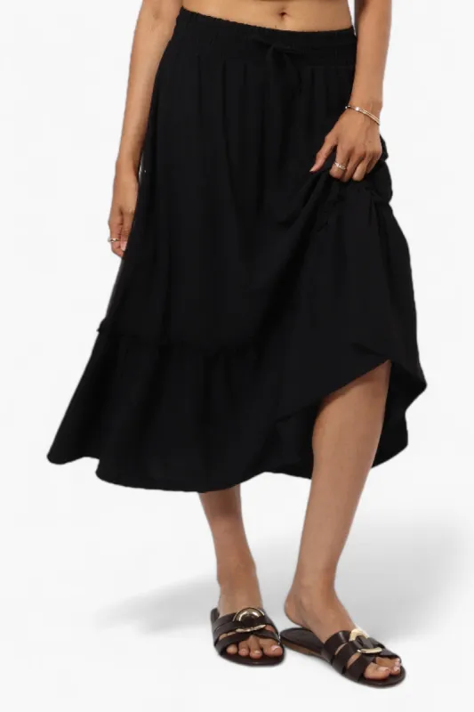Urbanology Solid Tie Waist Tiered Skirt - Black sold by Fairweather