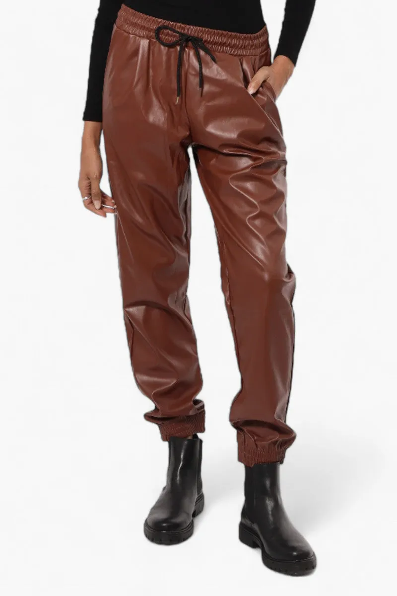 Limite Tie Waist Vegan Leather Jogger Pants - Brown sold by Fairweather
