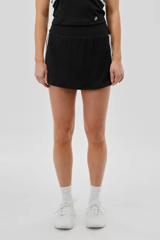 Body Instinct Striped Tennis Skirt - Black sold by Fairweather